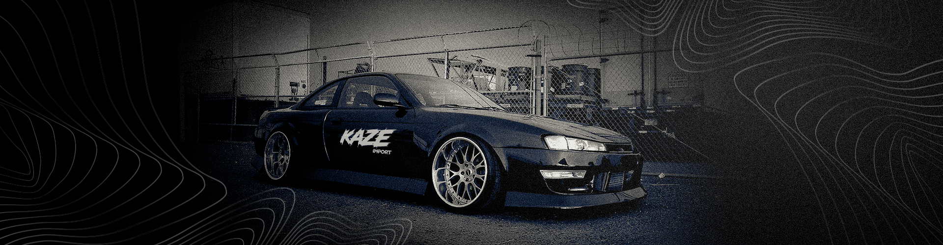 Nissan Silvia S14 negro con la gráfica de Kaze Import